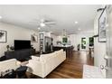 Bright and airy living room with hardwood floors, seamlessly connected to a modern kitchen, perfect for entertaining at 2343 Poplar Springs Ne Dr, Brookhaven, GA 30319
