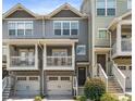 Charming townhome with double garage, covered balconies, and traditional design at 2015 Liberty Nw Ct, Atlanta, GA 30318