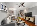 Comfortable living room featuring stylish decor, hardwood floors, and natural light at 2015 Liberty Nw Ct, Atlanta, GA 30318