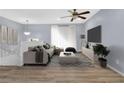 Bright living room with sleek floors, a cozy sofa, and modern decor, creating a welcoming space at 2496 Shiloh Dr, Decatur, GA 30034