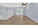 Open-concept living area with sleek flooring and natural light, providing a spacious and airy ambiance at 2496 Shiloh Dr, Decatur, GA 30034