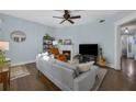 Light filled living room featuring a fireplace, hardwood floors, and neutral color palette at 746 N Highland Ne Ave # 7, Atlanta, GA 30306