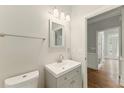 Elegant bathroom featuring a modern vanity, sleek fixtures, and a neutral color palette at 1502 Lake Koinonia Dr, Woodstock, GA 30189