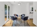Cozy breakfast nook with a set of modern chairs and natural light from sliding doors at 1997 N Landing Way, Marietta, GA 30066
