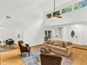 Open-concept living room with high ceilings, lots of natural light, and a view into the dining room at 1997 N Landing Way, Marietta, GA 30066