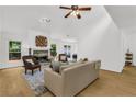 Bright living room featuring a stone fireplace, and hardwood flooring at 1997 N Landing Way, Marietta, GA 30066
