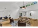 Sun-filled living area with vaulted ceilings, hardwood floors, and a cozy seating arrangement at 1997 N Landing Way, Marietta, GA 30066