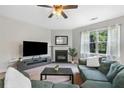 Inviting living room with a cozy fireplace and comfortable seating arrangements at 1925 Piedmont Cove Ln, Cumming, GA 30040