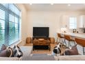 Comfortable living area with a plush sofa, stylish decor, and an open layout to the kitchen at 417 E College Ave # 102, Decatur, GA 30030