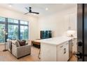 Cozy living space with a modern kitchen bar, hardwood floors, and lots of natural light at 417 E College Ave # 102, Decatur, GA 30030