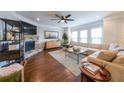 Bright living room with a fireplace, hardwood floors and large windows at 991 Sibley Ne Ln, Atlanta, GA 30324