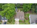 Aerial view of a home with a large lot, lush landscaping, a pool, and a separate guest house at 115 Ocee View Ct, Alpharetta, GA 30022