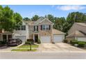 Charming townhome featuring a well-manicured lawn and a convenient one-car garage at 3313 Thornbridge Dr, Powder Springs, GA 30127