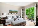 Comfortable living room with a cozy couch, balcony, and bright natural light at 351 Washington Ne Ave # 205, Marietta, GA 30060