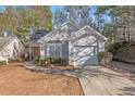 Well-maintained single-Gathering home with a charming facade, attached garage and mature landscaping in a tranquil neighborhood at 3700 Mays Xing, Atlanta, GA 30331
