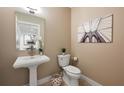 Charming powder room with pedestal sink, modern toilet, and stylish decor at 905 Juniper Ne St # 708, Atlanta, GA 30309