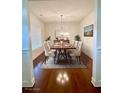 Bright dining room with a decorative table and seating for six at 1147 Halletts Peak Pl, Lawrenceville, GA 30044
