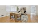 Cozy living room featuring stylish seating, light wood floors, neutral decor, and natural light at 1667 Atherton Cir, Decatur, GA 30035