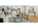Open-concept living space with modern kitchen, dining area, and comfortable seating arrangement at 1667 Atherton Cir, Decatur, GA 30035