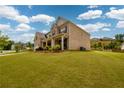 Beautiful brick two-story home with a well-manicured lawn and nice landscaping at 4832 Stone Way Path, Buford, GA 30519