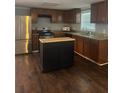 Well-equipped kitchen features stainless steel appliances and a center island at 2030 Carr Rd, Conyers, GA 30012