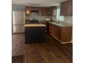 Modern kitchen features an island, stainless steel fridge, granite countertops and ample cabinet space at 2030 Carr Rd, Conyers, GA 30012