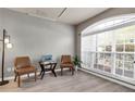 Bright and airy living room with modern flooring, large windows, and comfortable seating at 355 Pintail Ct, Suwanee, GA 30024