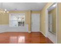 Dining room with hardwood floors, natural light, and chandelier at 2457 Swan Lake Dr, Grayson, GA 30017