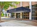 Elegant building entrance with a covered awning, showcasing the Windsor Over Peachtree address at 620 Peachtree Ne St # 403, Atlanta, GA 30308