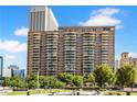 High-rise building exterior featuring multiple balconies and a view of the surrounding cityscape at 620 Peachtree Ne St # 403, Atlanta, GA 30308