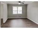 Bright bedroom with modern ceiling fan and new wood-look flooring at 2550 Stoney Brook Ne Ln, Marietta, GA 30062