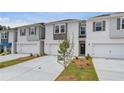 Charming townhomes with attached garages and professionally landscaped front yards at 305 Heavenly Hollow Pl, Mcdonough, GA 30253