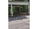 Designated parking area under a covered structure with parking space number at 3655 Peachtree Rd # 203, Atlanta, GA 30319
