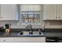 Close-up of the stainless steel sink, faucet, and countertops in a well-lit kitchen at 4150 Soaring Dr, Douglasville, GA 30135