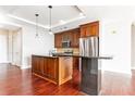 Beautiful kitchen with wood cabinets, island with granite counters, stainless steel appliances, and breakfast bar seating at 4561 Olde Perimeter Way # 2102, Atlanta, GA 30346