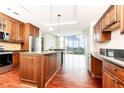 This lovely kitchen features stone countertops, stainless steel appliances, a large island and stunning views of the city at 4561 Olde Perimeter Way # 2102, Atlanta, GA 30346