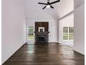 Spacious living room features high ceilings, hardwood floors, and fireplace at 130 Opal Ln, Carrollton, GA 30116