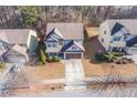 Aerial view of the home showcasing its location in a residential neighborhood at 1761 Stoney Chase Dr, Lawrenceville, GA 30044