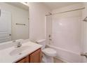 Clean bathroom with a tub/shower combination, a vanity, and a toilet at 1761 Stoney Chase Dr, Lawrenceville, GA 30044