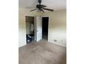 Cozy bedroom with plush carpeting and a ceiling fan for added comfort at 4701 Flat Shoals Rd # 65A, Union City, GA 30291