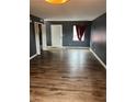 Spacious living room boasts sleek wood floors and a freshly painted accent wall at 4701 Flat Shoals Rd # 65A, Union City, GA 30291