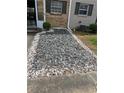 Home exterior featuring decorative rock landscaping around the front of the house at 4701 Flat Shoals Rd # 65A, Union City, GA 30291