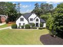 Stunning two-story home with an arched entryway and well-manicured lawn at 503 Chatfield Nw Way, Marietta, GA 30064