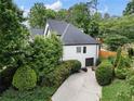 A charming home exterior featuring a driveway and manicured landscaping at 503 Chatfield Nw Way, Marietta, GA 30064
