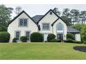 Attractive two-story home with a well-maintained lawn and traditional architectural details at 503 Chatfield Nw Way, Marietta, GA 30064