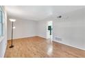 Inviting living room with hardwood floors and a bright view into the kitchen area at 3137 Buford Ne Hwy # 11, Brookhaven, GA 30329