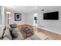 Bright living room with hardwood floors, neutral walls, and modern fixtures at 3137 Buford Ne Hwy # 11, Brookhaven, GA 30329