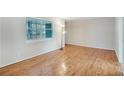 Bright and airy living room featuring gleaming hardwood floors and a large window at 3137 Buford Ne Hwy # 11, Brookhaven, GA 30329