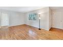 Bright living room featuring gleaming hardwood floors, large windows, and neutral paint at 3137 Buford Ne Hwy # 11, Brookhaven, GA 30329