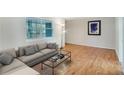 Inviting living room with hardwood floors, natural light and a stylish seating arrangement at 3137 Buford Ne Hwy # 11, Brookhaven, GA 30329